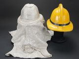 a fireman hat and a fireman ' s hat on a table