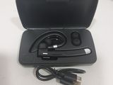 a black case with ear buds and a charger in it