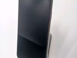 a cell phone that is sitting on top of a stand