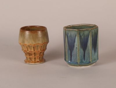 two cups sitting next to each other on a table