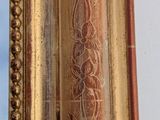 an image of a gold frame with a decorative pattern on it