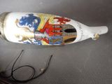 a bottle with a picture on it sitting on a table