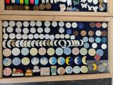 a display case with buttons and magnets on it