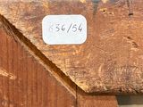 a close up of a piece of wood with a number on it