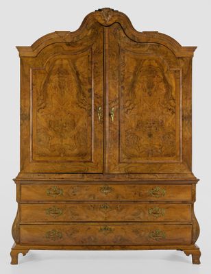 an antique wooden cabinet with two doors and drawers