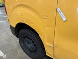 a yellow van with a sticker on the side of it