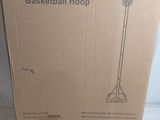 the box has a basketball hoop inside of it on the floor