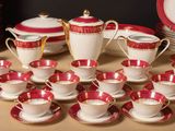 a lot of cups and saucers on the table