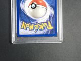 a close up of a pokemon card with a white ball in the center