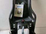 a black chair with a seat and a book on it