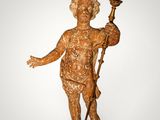 an image of a statue of a boy holding a torch