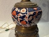 a lamp that is sitting on a stand on a table