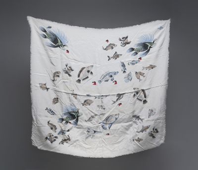 an image of a white cloth with birds on it hanging on a wall