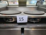 a sign that says 15 on the front of an electric stove