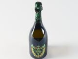 bottle of champagne with a green and gold label on a white background