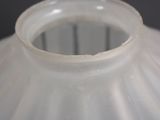 a close up of a white vase with a black background