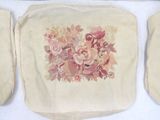 three bags with flowers on them sitting on a table