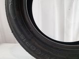 a close up of a tire on a white surface