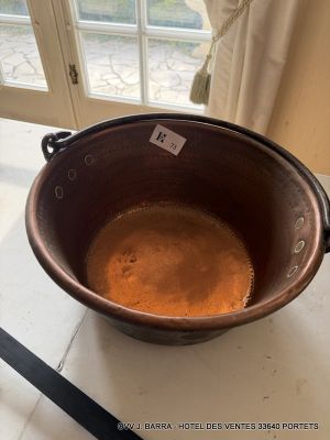 a brown bowl sitting on top of a table next to a window