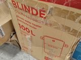 a pile of boxes sitting on the ground next to each other