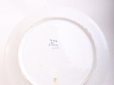 a white plate that has a black and white design on it