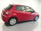 the red car is parked in the showroom of a dealers showroom