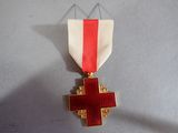 a red cross on a white ribbon with a red cross on it