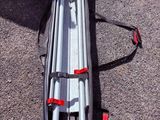 a camera tripod sitting on the ground next to a person