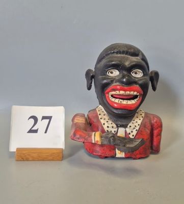 a small statue of a man with a number 27 on it