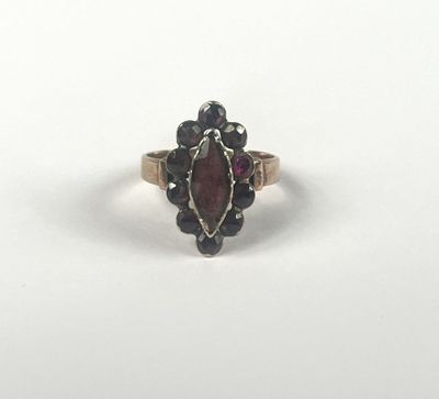 a close up of a ring on a white surface