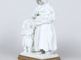 an image of a statue of a woman holding a baby and a child