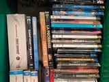 a lot of dvds in a green box on the shelf