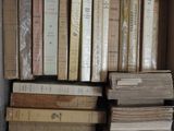 a lot of books that are sitting on a shelf