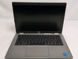 an open laptop computer sitting on top of a white surface