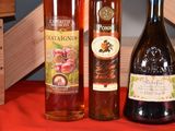 three bottles of wine sitting next to each other on a table