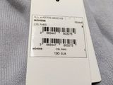 a label on the back of a gray shirt