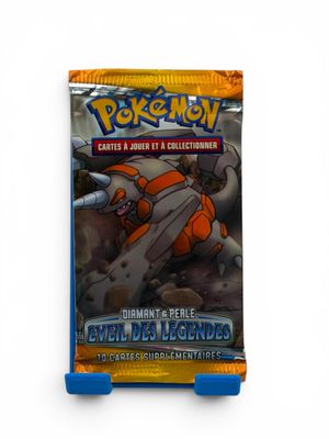 a close up of a box of pokemon cards on a white surface