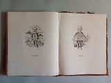 an open book with a drawing of a man and a woman