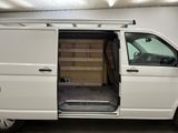 a white van with its doors open in a garage