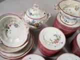 a lot of plates and bowls that are sitting on a table