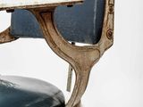 a chair that has a seat that is attached to the back of it