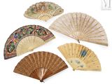 several different types of hand fans are displayed on a white surface
