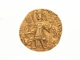 une vieille pièce d'or sur laquelle figure l'effigie d'un homme tenant une épée