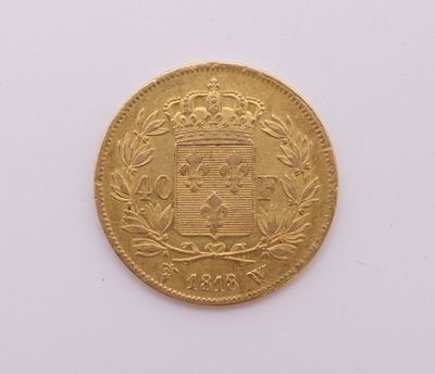 a close up of a gold coin on a white surface