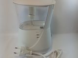an image of a water pitcher with a cord plugged into it