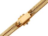 an image of a close up of a gold watch on a white background