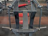 a gym room with a row of machines in it