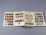 an open book with a bunch of stamps on it