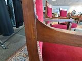 a red chair that is sitting in a room