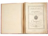 un livre ouvert sur une page blanche bordée de rouge